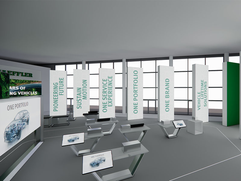 Una moderna sala de exposiciones con pantallas digitales en las que se muestran temas relacionados con el sector de la automoción y eslóganes como «Pioneering Future» y «One Brand», en la que se presentan las innovaciones de Schaeffler y se destacan soluciones para las reparaciones en el taller, todo ello como parte de la experiencia de Automechanika 2026.